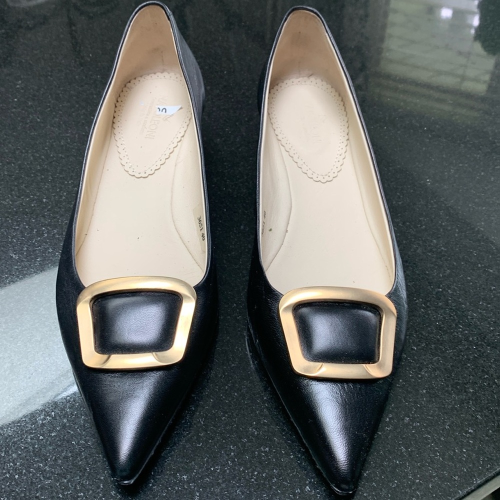Black Italian leather shoes with gold buckle on front. 1 1/4 inch heel.